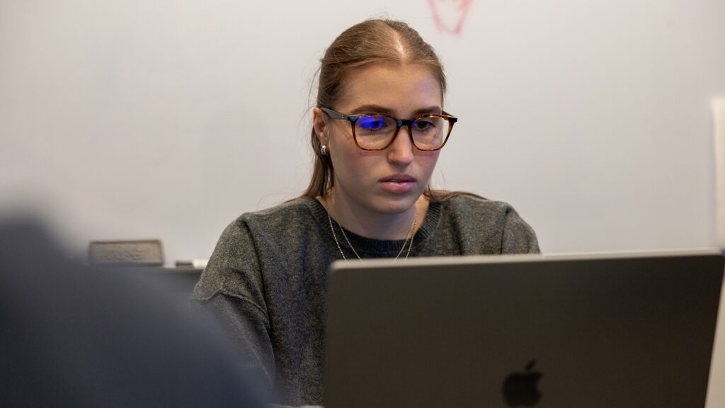 A business employee works on leads