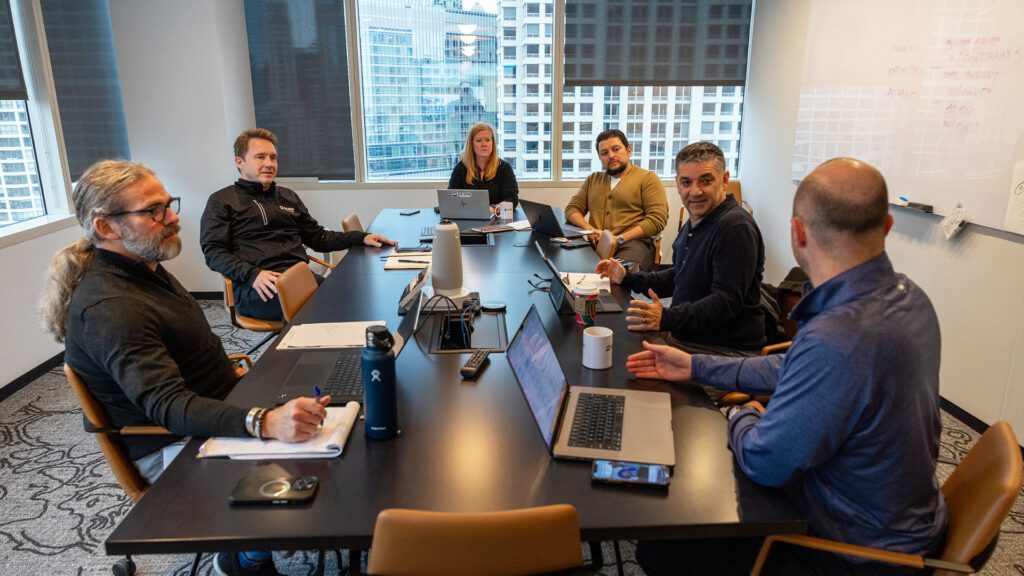 Employees of an agency work on a marketing plan.